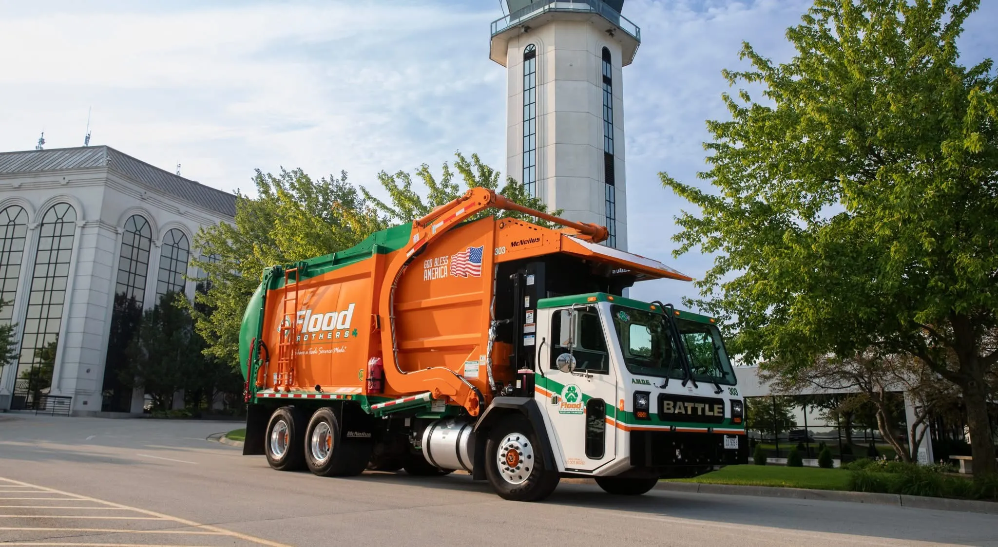 Flood Brothers residential truck in a neighborhood