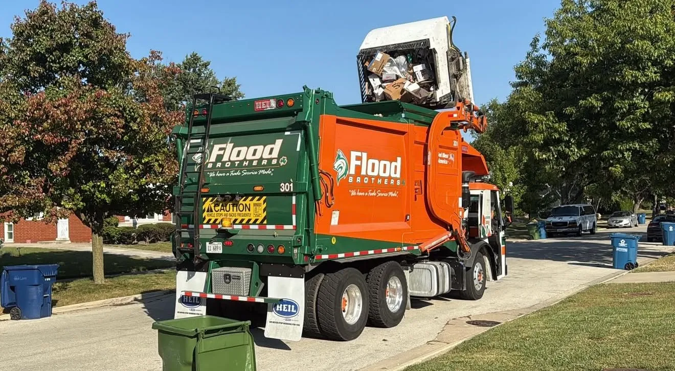 Flood Brothers residential truck in a neighborhood
