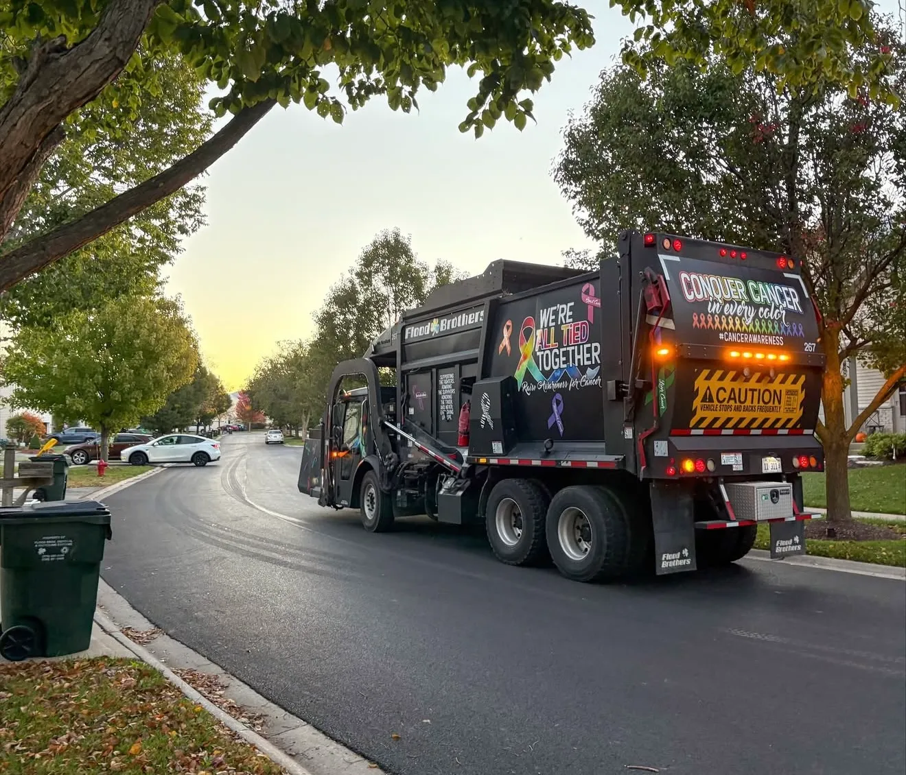 Flood Brothers residential truck in a neighborhood